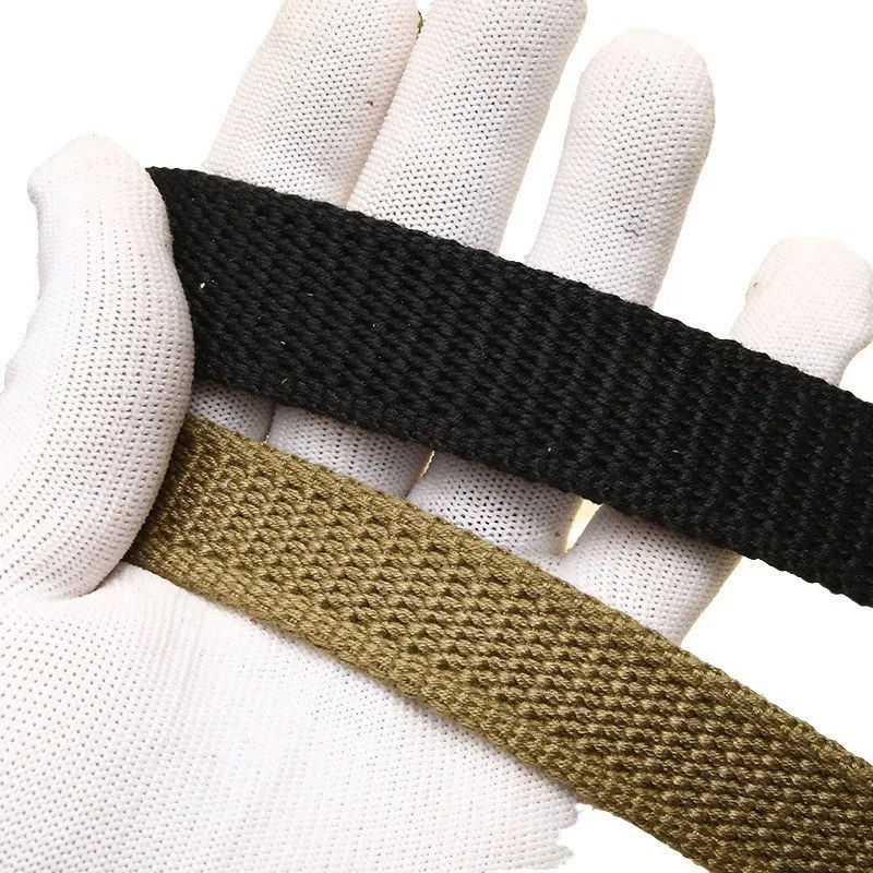Close-up of the woven cotton canvas strap in black and army green
