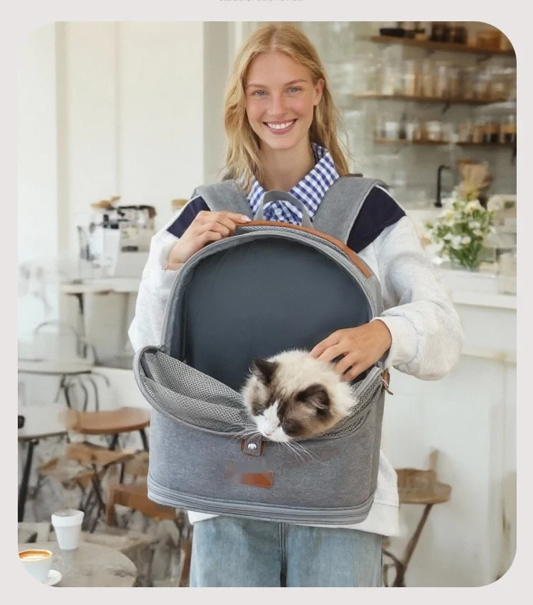 Woman holding the foldable mesh pet backpack with a cat inside