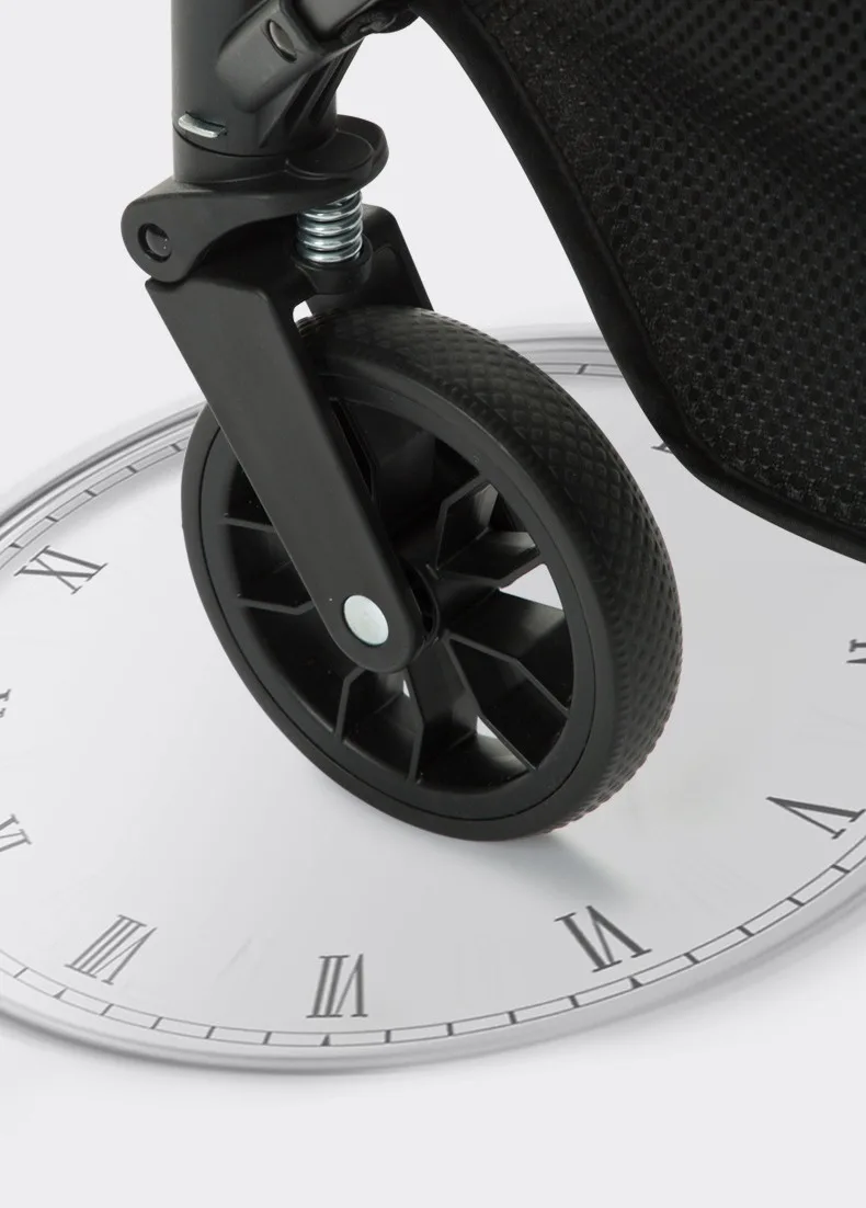 Close-up of the foldable pet stroller front swivel wheel and suspension spring