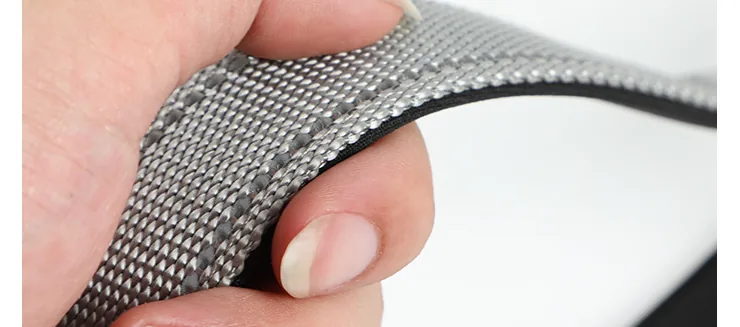 Close-up of the grey woven webbing texture of the hands-free crossbody dog leash