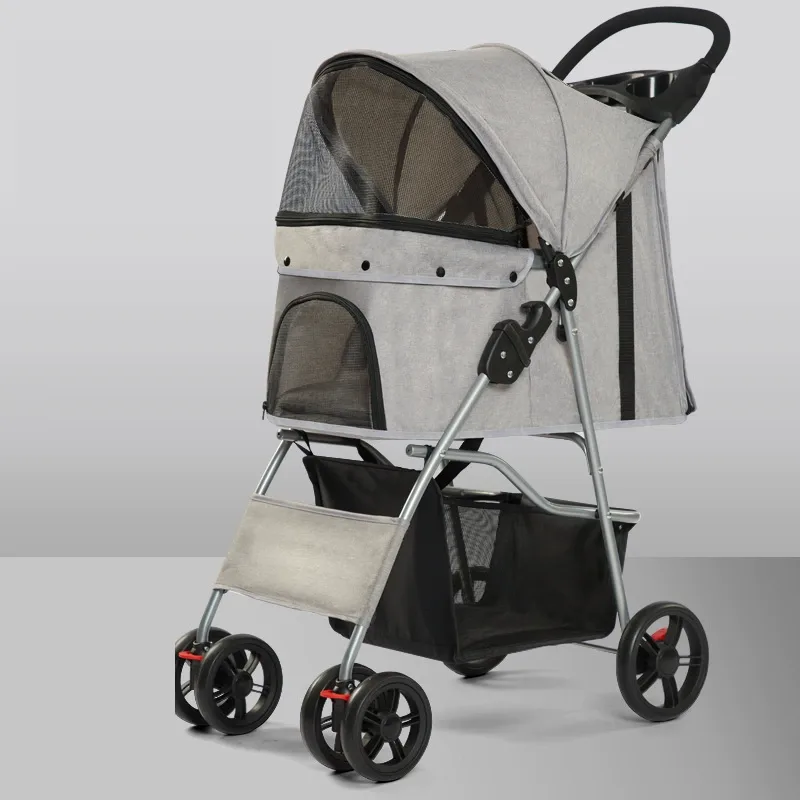 Grey foldable pet stroller, side view on a studio background