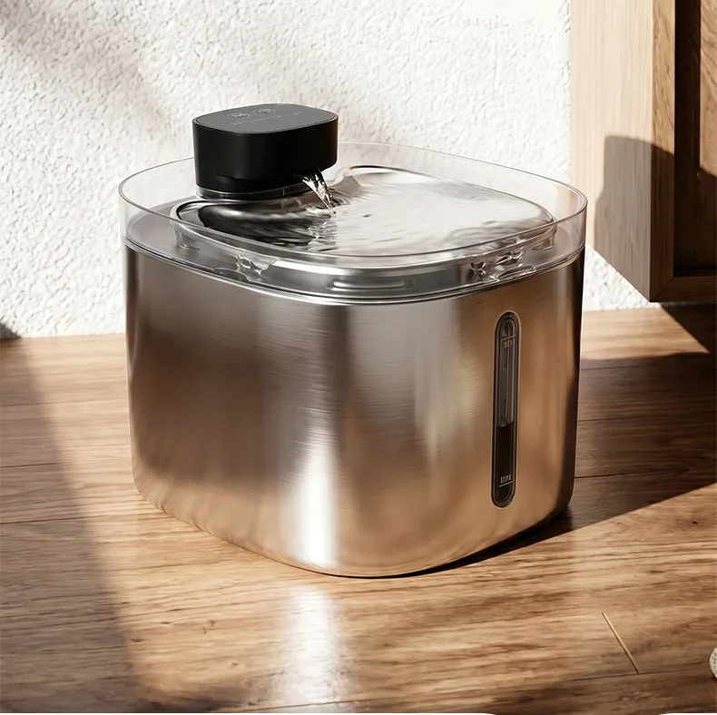 Stainless steel pet water fountain on a wooden floor