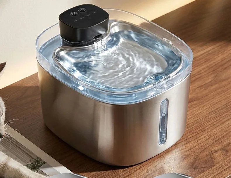 Stainless steel pet water fountain on a wooden table