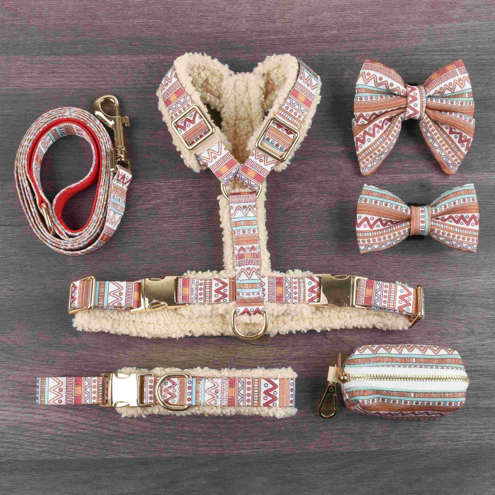 Cream teddy fleece dog harness with coiled patterned leash and two matching patterned bow ties