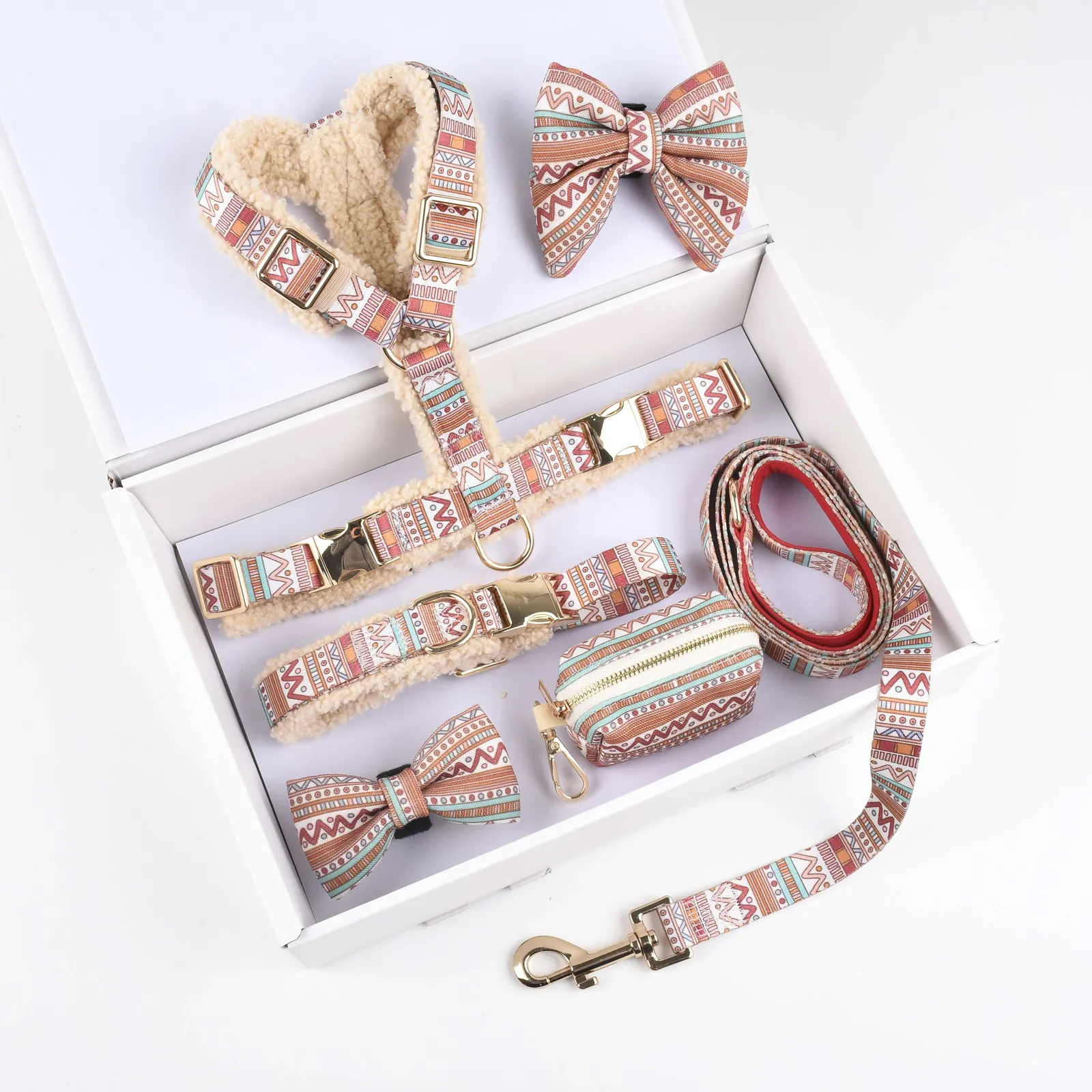Cream teddy fleece dog harness with patterned straps, shown beside a matching patterned bow tie